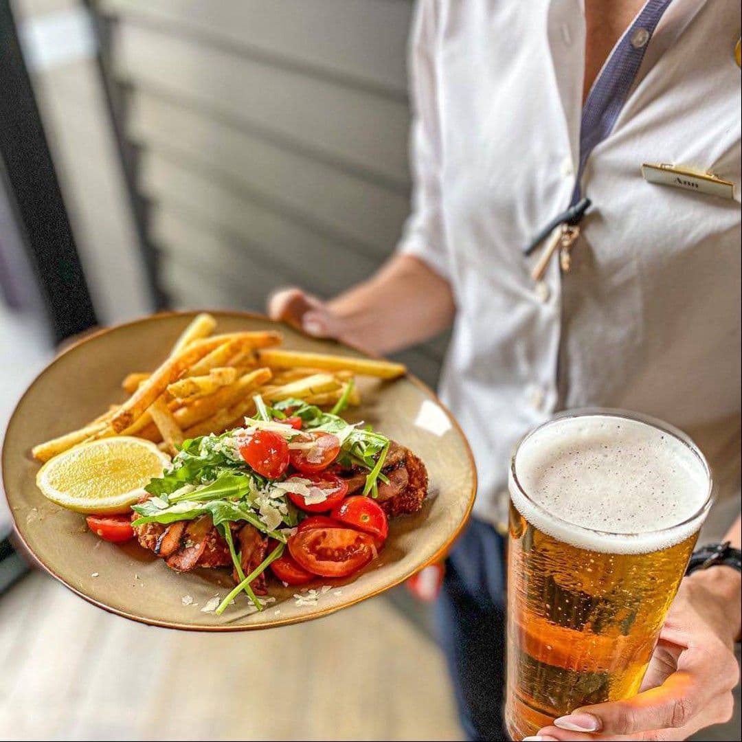 bartender-holding-meal-and-drink