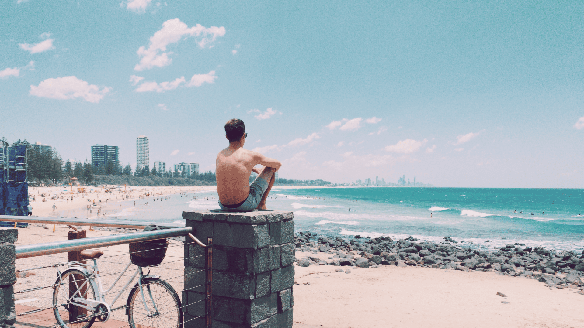 Man-sitting-watching-surf