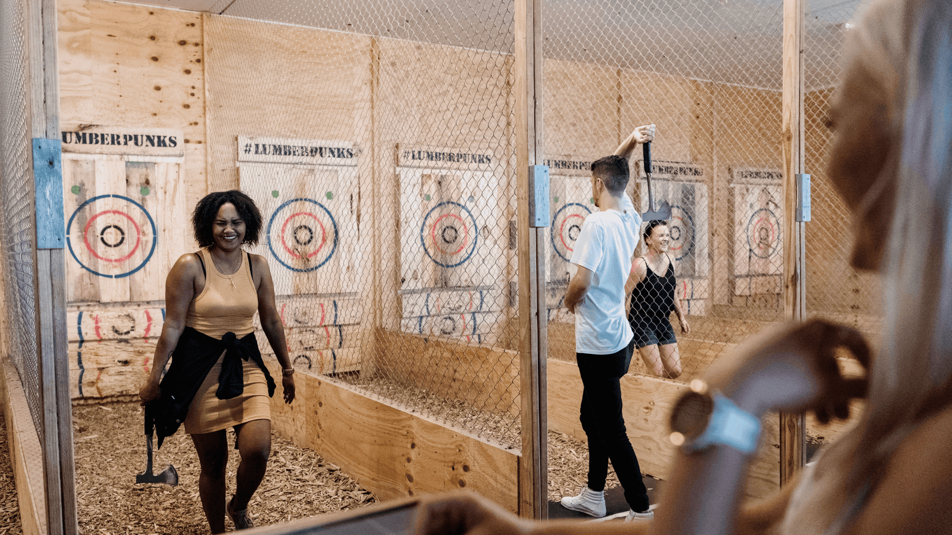 people-enjoying-indoor-axe-throwing