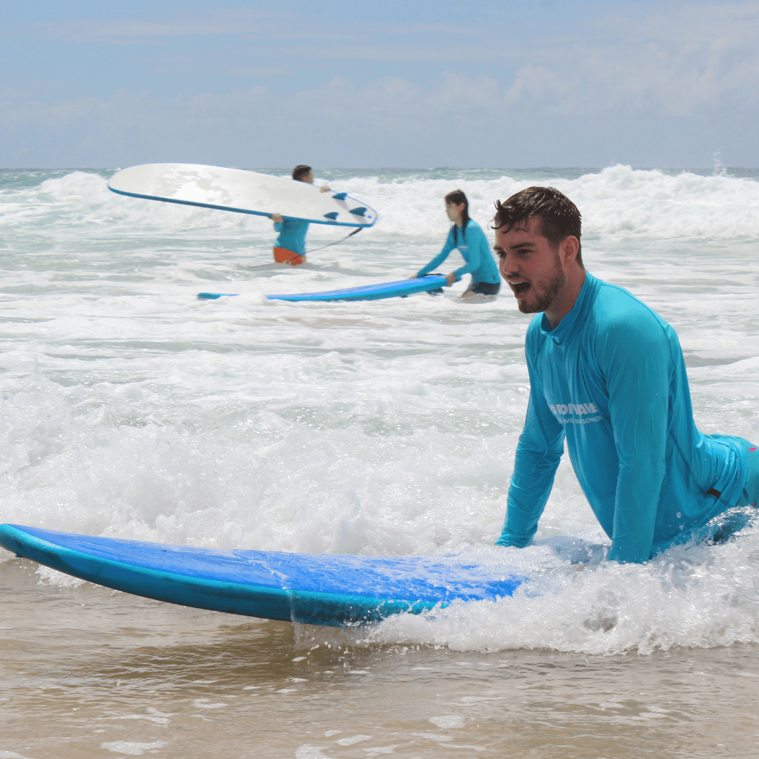 Beginner surfer catching a wave